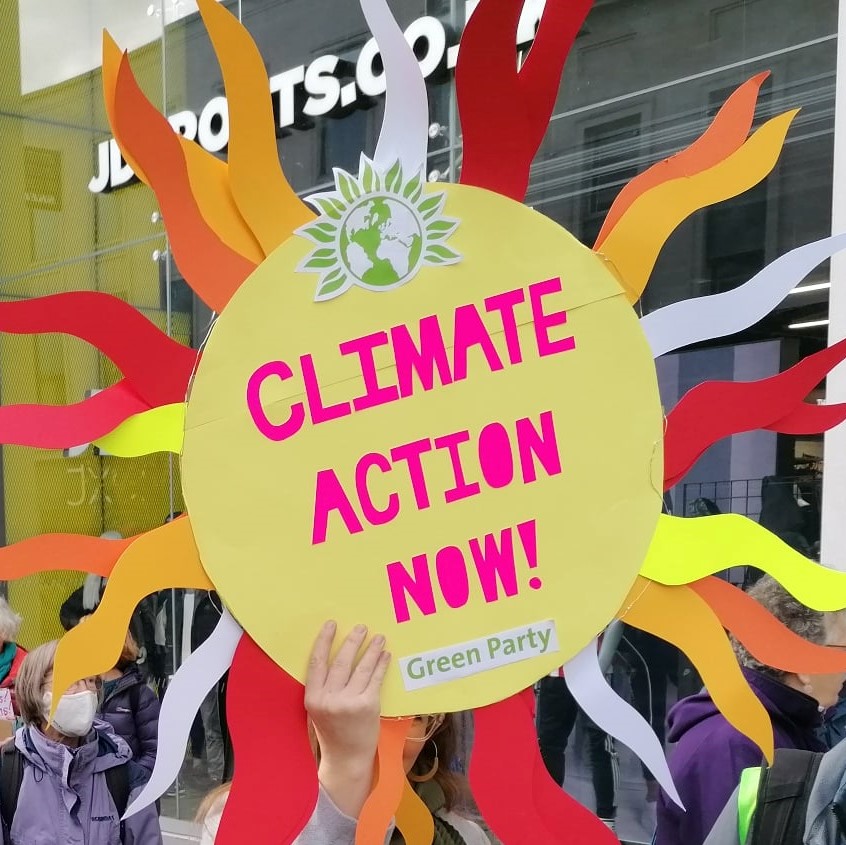 Sign saying 'climate action now!'