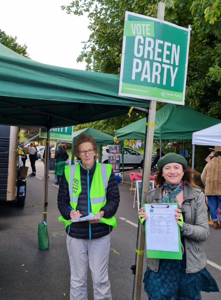 Green Campaigner Rachel Hope with Green Councillor Marieanne Elliot collecting signatures for their petition to save the 10/10a bus service.