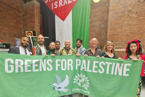 Greens for Palestine banner in front of elected Greens including Zack Polanski, Mothin Ali, Peter Gilbert, Alexi Dimond, Marieanne Elliot, Douglas Johnson and Hau Yu