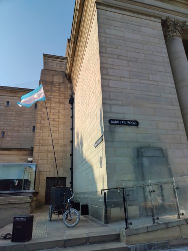 Transgender pride flag flying on a tricycle outside Sheffield City Hall